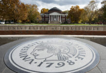 The Minerva Seal in front of the Oval with Grawemeyer Hall.