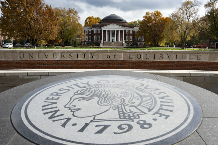 The Minerva Seal in front of the Oval with Grawemeyer Hall.