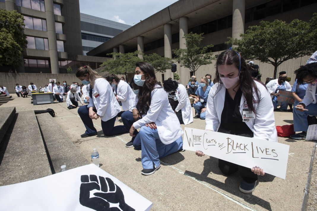 Medical students, residents and faculty take part in White Coats for Black Lives