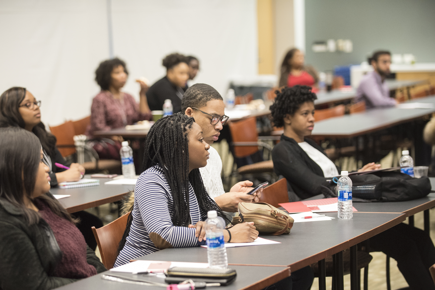 Diverse group of students listen to a presentation.