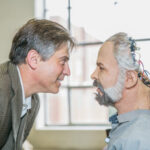 Robotics researcher Dan Popa, Ph.D., with one of his robots