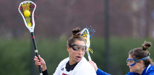 Shayla Scanlan playing lacrosse.