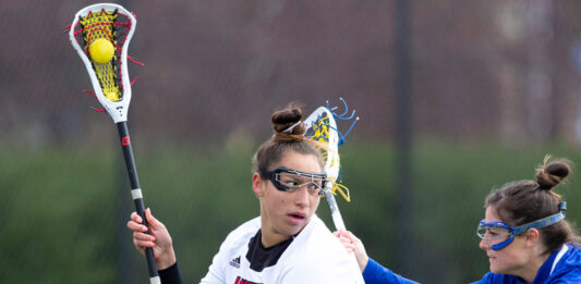 Shayla Scanlan playing lacrosse.