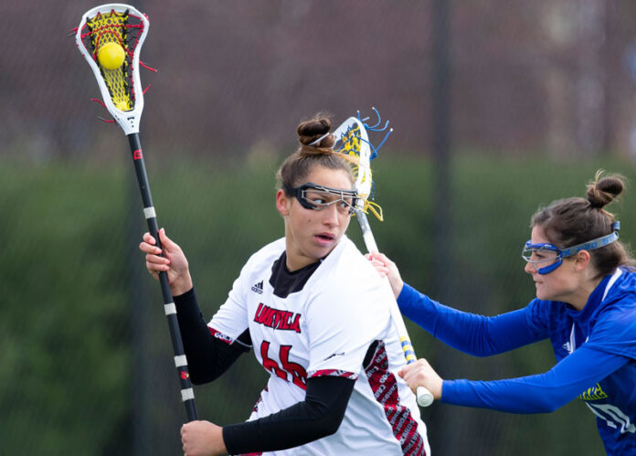 Shayla Scanlan playing lacrosse.