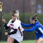 Shayla Scanlan playing lacrosse