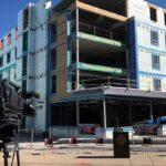 The topmost beam of a new student residence hall was set into place, marking a milestone toward the building’s completion. Photo courtesy of Messer Construction Co.