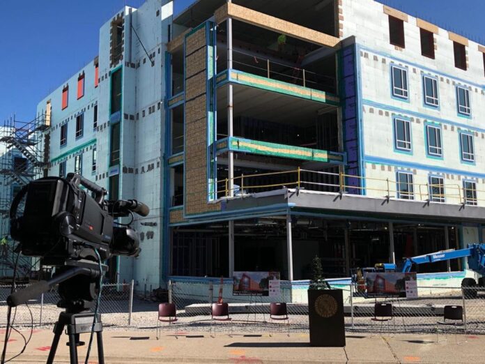 The topmost beam of a new student residence hall was set into place, marking a milestone toward the building’s completion. Photo courtesy of Messer Construction Co.