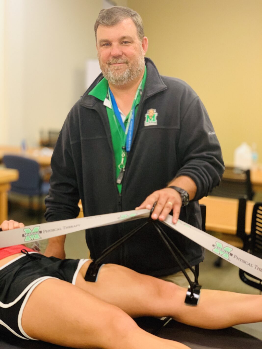 Brad Profitt with the therapeutic device he invented