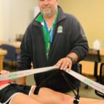 Brad Profitt with the therapeutic device he invented
