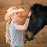 Elizabeth James, Ph.D., with her horse, Ozzie. (Photo by Dan James)