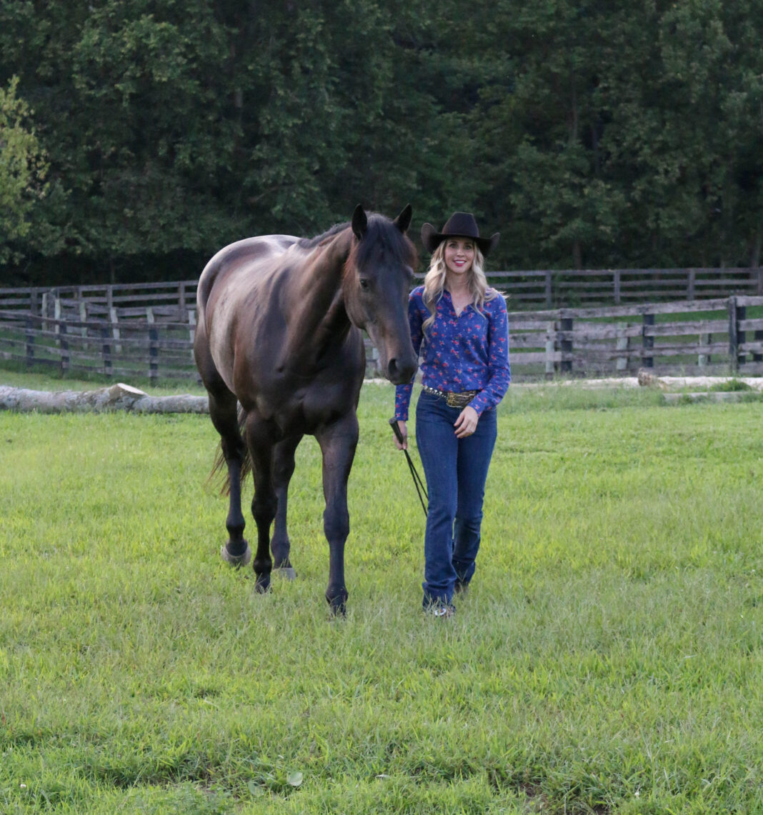 Elizabeth James, Ph.D., with her horse, Ozzie. (Photo by Alaina Alderman)