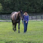 Elizabeth James, Ph.D., with her horse, Ozzie. (Photo by Alaina Alderman)