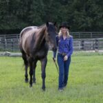 Elizabeth James, Ph.D., with her horse, Ozzie. (Photo by Alaina Alderman)