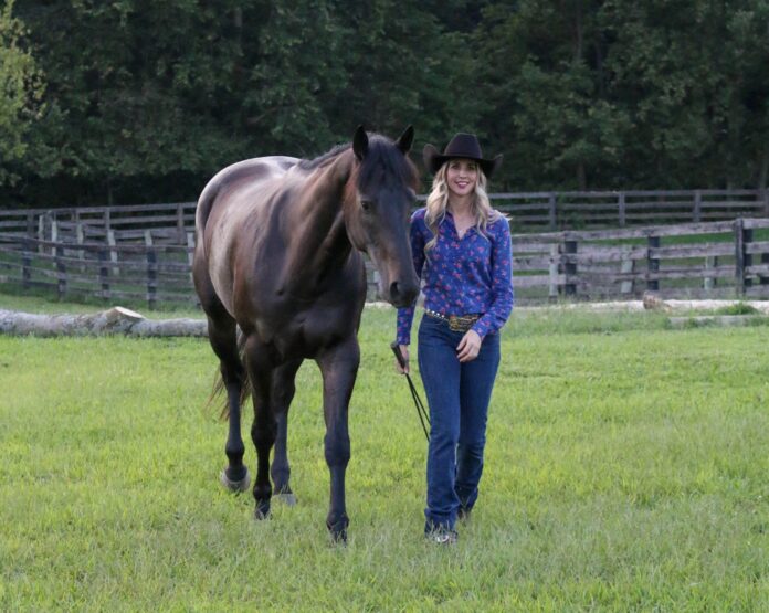Elizabeth James, Ph.D., with her horse, Ozzie. (Photo by Alaina Alderman)