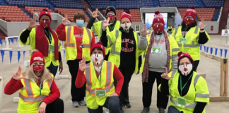 UofL faculty at Broadbent Arena drive-thru vaccination event