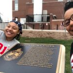 Photo of Dr. Beverly Frye and Kennedy Frye posing in front of the Delta Sigma Theta NPHC marker.