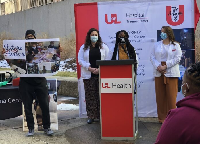 Christopher 2X with UofL medical students Jenci Hawthorne, Karen Udoh and Briana Coleman at the presentation of the Kelsie Small Future Healer Award on Feb. 23.