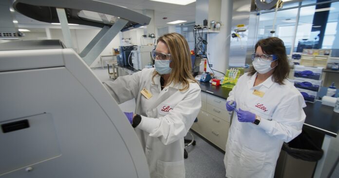 Eli Lilly and Company staff conducting release and stability testing of the clinical trial materials. Photo courtesy Eli Lilly and Company