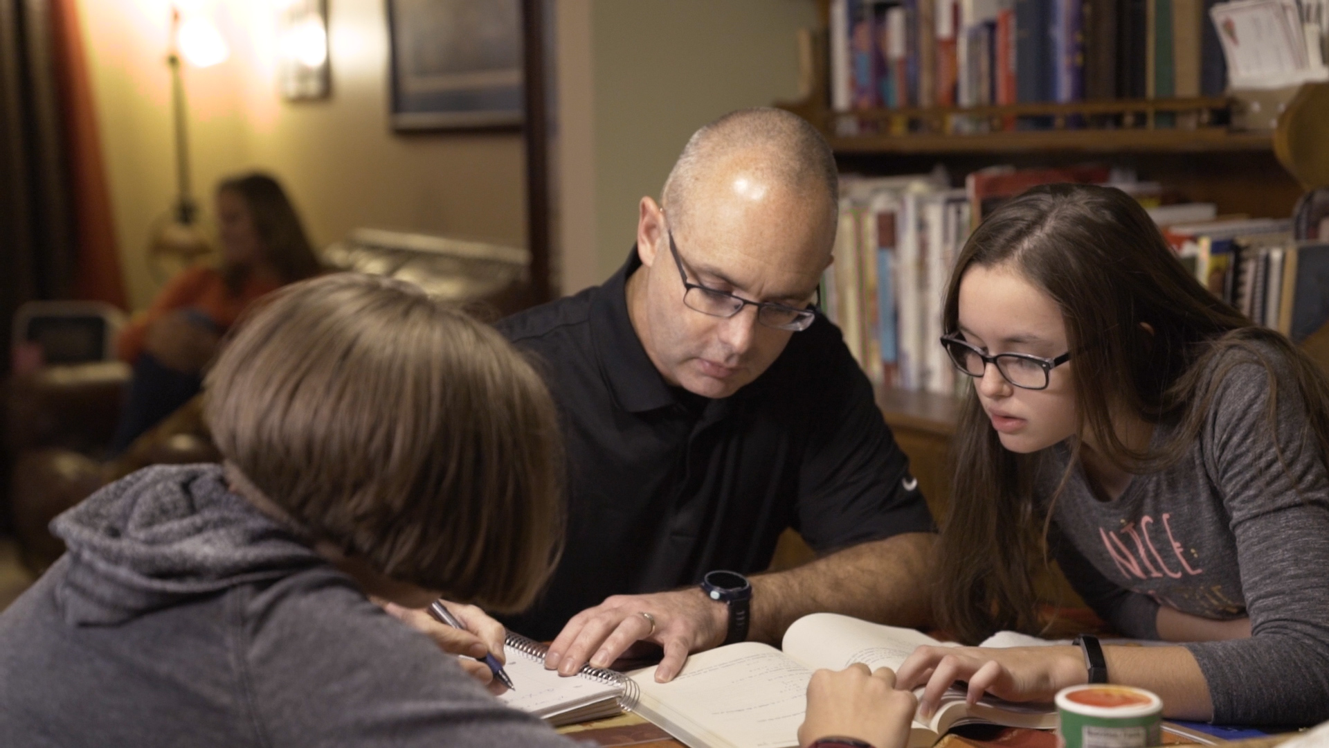 UofL online learning student David Beumer studying at home with family.