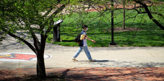 A student walks across campus.