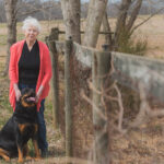 Woman standing with dog