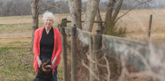 Woman standing with dog