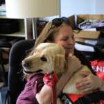 Jan Rayburn gives Jake a hug.