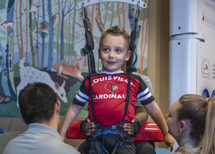MacIntyre_Malcolm_2020 Malcolm MacIntyre, a patient at the Kosair Charities Center for Pediatrc NeuroRecovery, uses the specially designed pediatric treadmill for children.