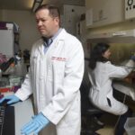 COBRE project investigator Joshua L. Hood, M.D., Ph.D., left, and research technician Gina Bardi