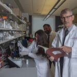 Craig McClain, M.D., right, with Matthew Cave, M.D., liver researcher and H&T COBRE core director, center, and Jamie Young, Ph.D., using equipment known as the NanoDrop instrument to analyze RNA and DNA samples.