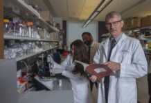 Craig McClain, M.D., right, with Matthew Cave, M.D., liver researcher and H&T COBRE core director, center, and Jamie Young, Ph.D., using equipment known as the NanoDrop instrument to analyze RNA and DNA samples.