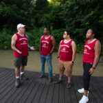 Law professor Tony Arnold talks with law students Cameron Lyons, Frank Bencomo and Lauren Neal