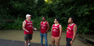 Law professor Tony Arnold talks with law students Cameron Lyons, Frank Bencomo and Lauren Neal