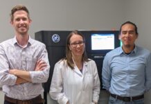 Corey Watson, Ph.D., Melissa Smith, Ph.D., and Oscar Rodriguez, Ph.D., with the Pacific Biosciences Sequel IIe DNA sequencing system, housed in the University of Louisville Sequencing Technology Center