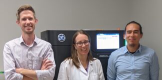 Corey Watson, Ph.D., Melissa Smith, Ph.D., and Oscar Rodriguez, Ph.D., with the Pacific Biosciences Sequel IIe DNA sequencing system, housed in the University of Louisville Sequencing Technology Center