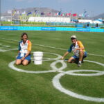 UofL Professor Mary Hums (right) at the Athens Olympics in 2004