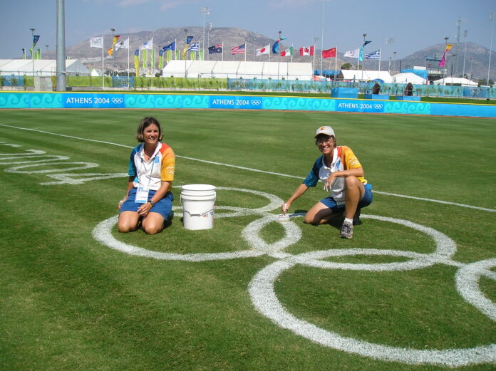 UofL Professor Mary Hums (right) at the Athens Olympics in 2004