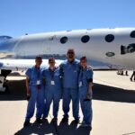 UofL astrosurgery team members George Pantalos, bioengineering student Sienna Shacklette, Tommy Roussel and bioengineering student Clara Jones in front of the Virgin Galactic VSS Unity SpaceShipTwo at Spaceport America in New Mexico. Photo courtesy Virgin Galactic.