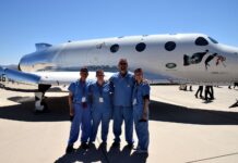 UofL astrosurgery team members George Pantalos, bioengineering student Sienna Shacklette, Tommy Roussel and bioengineering student Clara Jones in front of the Virgin Galactic VSS Unity SpaceShipTwo at Spaceport America in New Mexico. Photo courtesy Virgin Galactic.