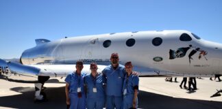 UofL astrosurgery team members George Pantalos, bioengineering student Sienna Shacklette, Tommy Roussel and bioengineering student Clara Jones in front of the Virgin Galactic VSS Unity SpaceShipTwo at Spaceport America in New Mexico. Photo courtesy Virgin Galactic.