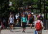 Students walking on the SAC bridge, Belknap Campus