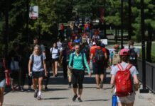Students walking on the SAC bridge, Belknap Campus