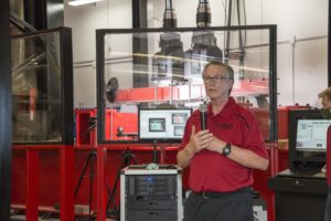 Mark McGinley, professor and Endowed Chair for Infrastructure Research in UofL’s Department of Civil and Environmental Engineering with the actuator system at the Dahlem Infrastructure Structural Testing Lab Facility.