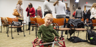 Luke Madson on a specially designed pediatric treadmill for therapy at the Kosair Charities Center for Pediatric Neurorecovery