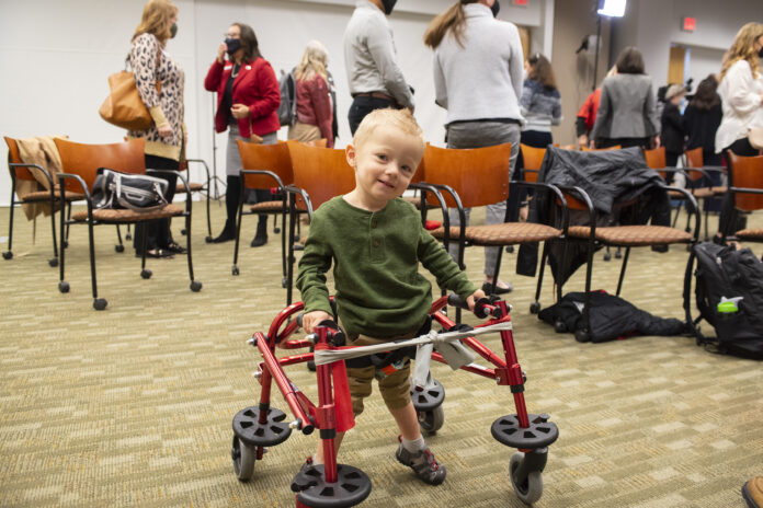 Luke Madson on a specially designed pediatric treadmill for therapy at the Kosair Charities Center for Pediatric Neurorecovery