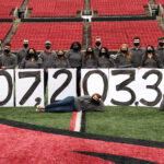 raiseRED students holding their $507,203.37 total