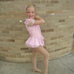 Morgan Proctor with her baton as a child.