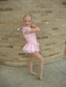 Morgan Proctor with her baton as a child.