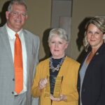 Laura Rothstein (center), accepts the 2021 LBA Diversity Trailblazer Award, with Joe Gutmann (left) and Deena Ombres (right), president of the Louisville Bar Association