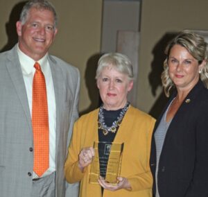 Laura Rothstein (center), accepts the 2021 LBA Diversity Trailblazer Award, with Joe Gutmann (left) and Deena Ombres (right), president of the Louisville Bar Association 